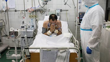 A medical worker treats a patient suffering from the coronavirus disease (COVID-19) inside the Intensive Care Unit at the Hospital for Infectious and Tropical Diseases of the Clinical Center of Serbia in Belgrade. (Reuters)