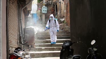 An Indian municipal worker disinfects an area during lockdown to prevent the spread of new coronavirus in Jammu, India on April 16, 2020. (AP)