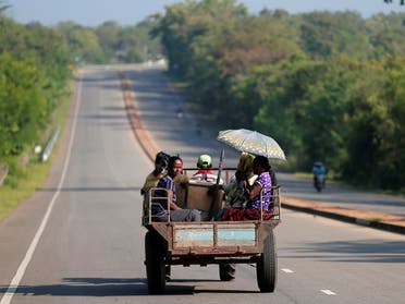 Villagers travel in a tractor on a newly built road in Hambantota, Sri Lanka March 24, 2019. (Reuters)