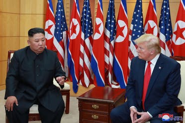 US President Donald Trump speaks with North Korean leader Kim Jong Un during a meeting at the demilitarized zone separating the two Koreas, in Panmunjom, South Korea, June 30, 2019. (Reuters)
