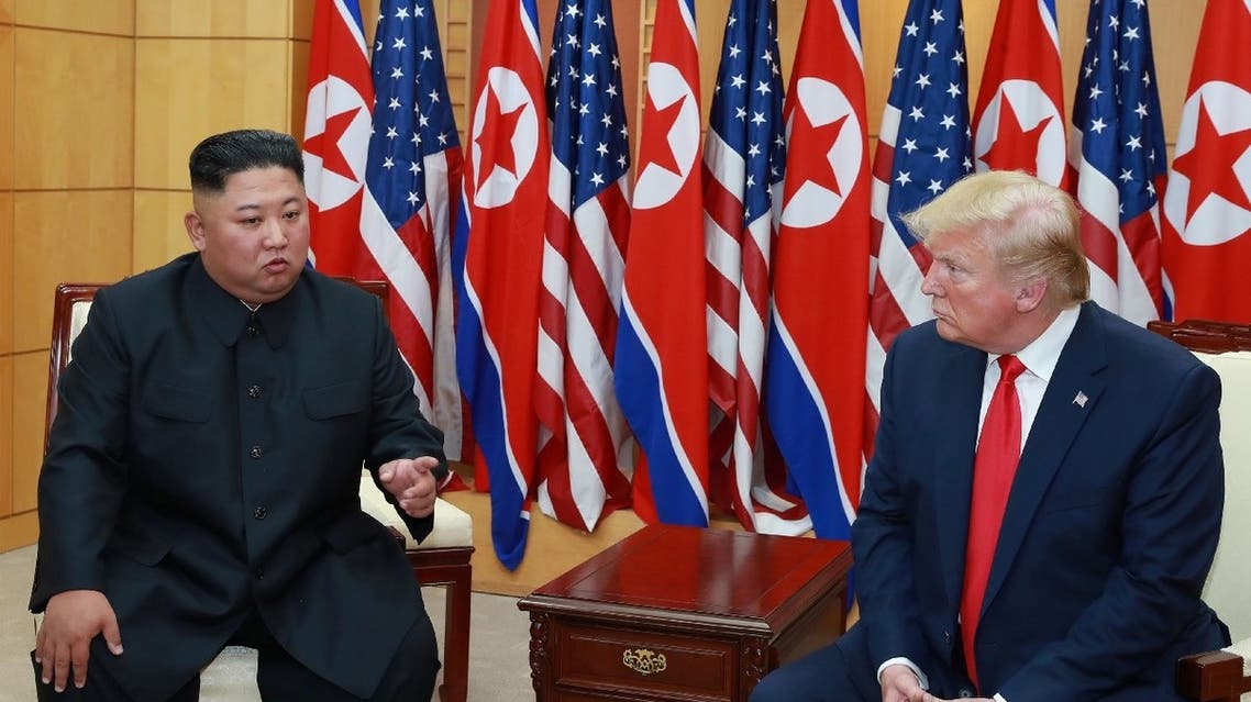 US President Donald Trump speaks with North Korean leader Kim Jong Un during a meeting at the demilitarized zone separating the two Koreas, in Panmunjom, South Korea, June 30, 2019. (Reuters)