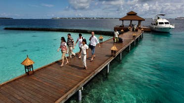 Foreign tourists arrive in a resort in the Kurumba island in Maldives on Feb. 12, 2012. (AP)