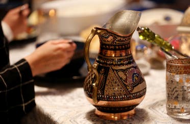 An intricate water vase sits on the table as a family eats their iftar meal on the first day of Ramadan in Bellevue. (File photo: Reuters)