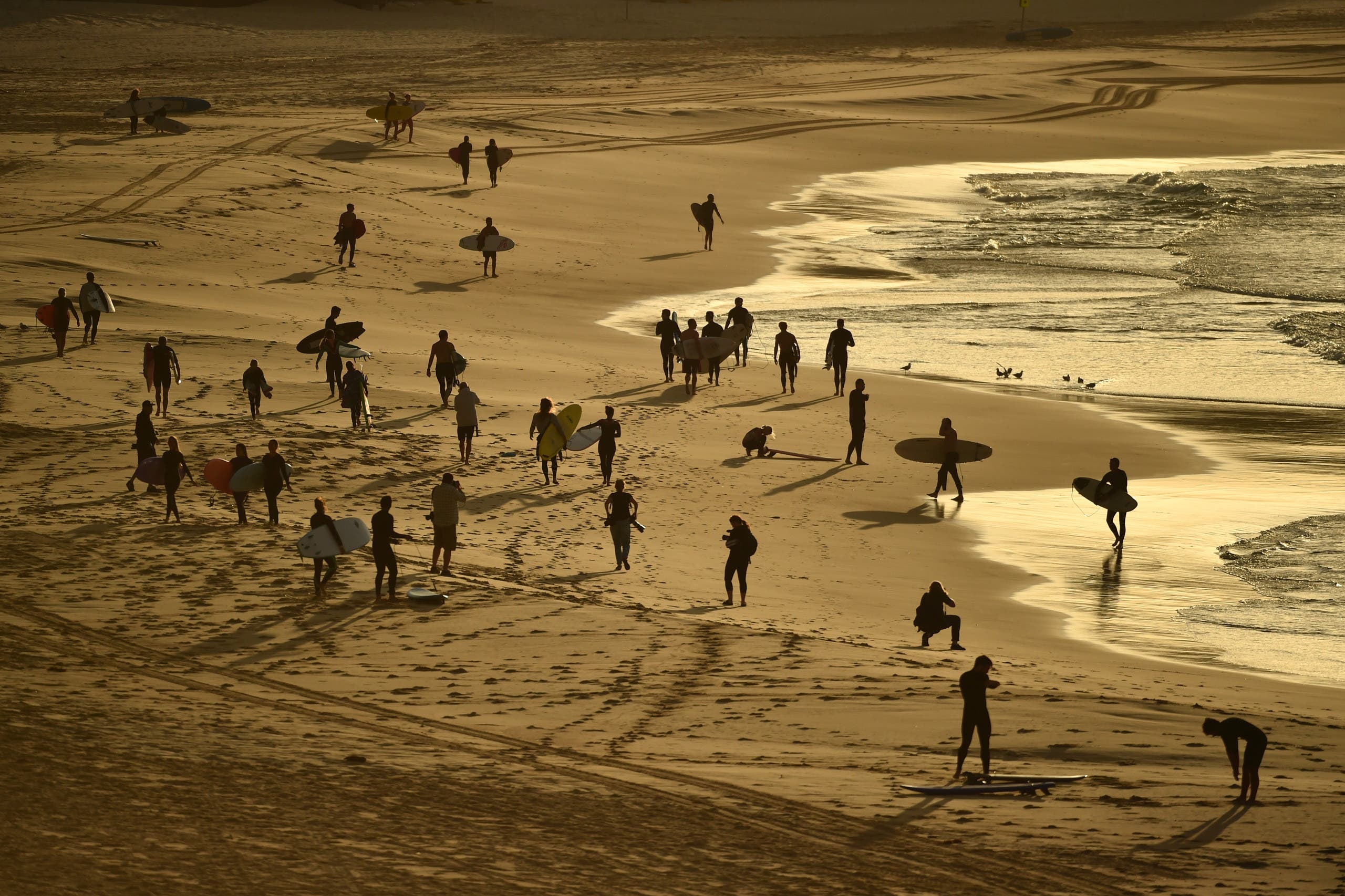 Surfers return to Bondi Beach. (AFP)