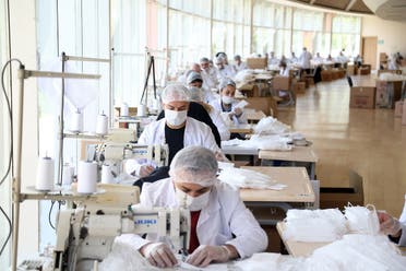 Employees of Ankara Metropolitan Municipality youth center sews face masks, in Ankara, Turkey, on April 28, 2020, amid the spread of the novel coronavirus. (AFP)