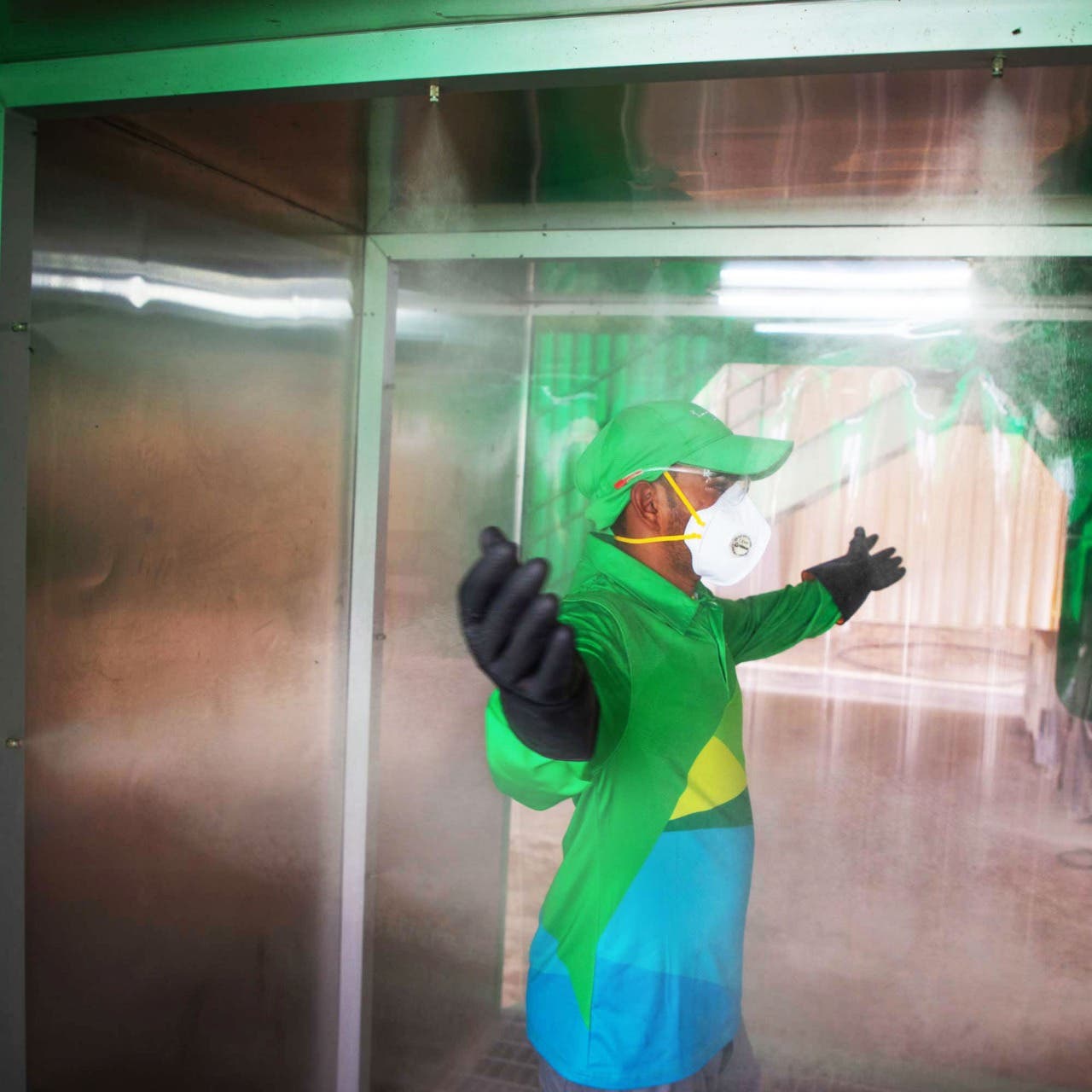A Bee'ah employee trials a disinfection pod, April 27, 2020. (WAM)