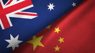 China and Australia flags flying together for diplomatic talks stock photo