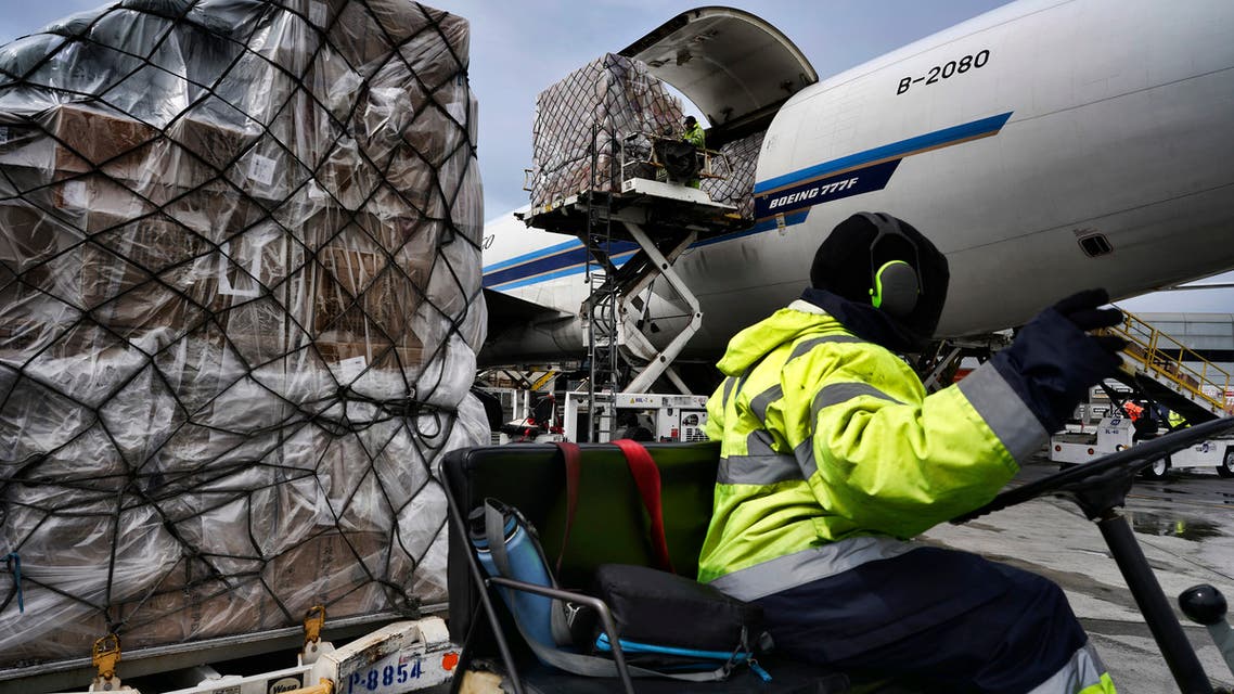 Ground crew at the Los Angeles International airport unload pallets of supplies of medical personal protective equipment, PPE, from a China Southern Cargo plane upon arrival on Friday, April 10, 2020.
