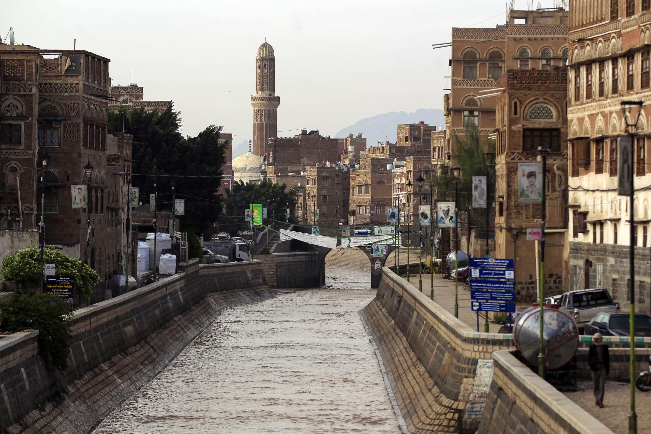 Flood water fills a canal following heavy rains in the Old City of Yemen's capital Sanaa on April 14, 2020. (AFP)