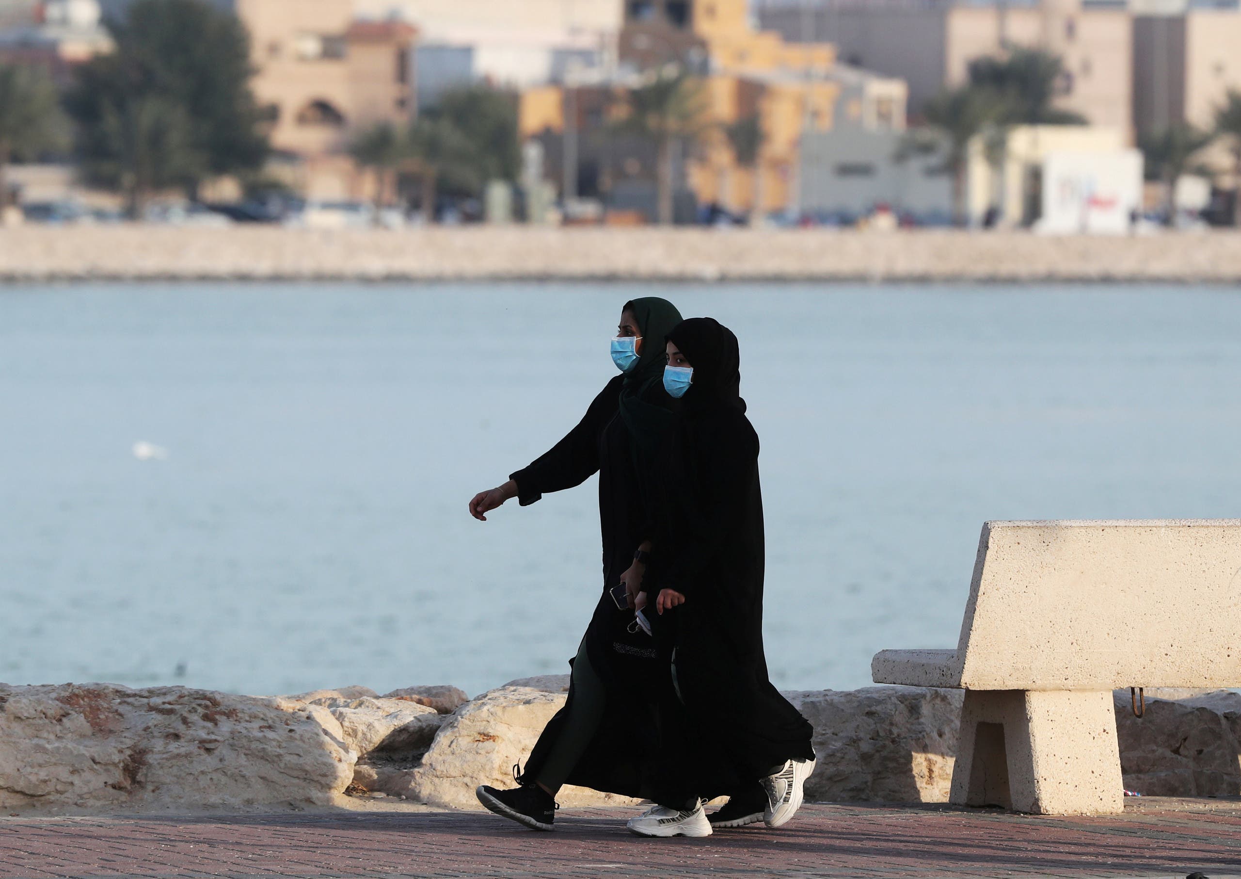 Women wear protective face masks, as they walk, after Saudi Arabia imposed a temporary lockdown on the province of Qatif, following the spread of coronavirus, in Qatif, Saudi Arabia March 10, 2020. (File photo; Reuters)