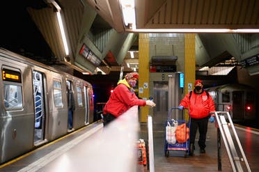 Jose Gonzalez and Jose Niejiaz of Guardian Angels deliver food and essentials to people in need in the subway on April 29, 2020 in New York City. (AFP)