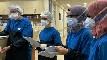 Medical personnel participate in a briefing at Istanbul University Cerrahpasa Hospital's ward dedicated to patients with coronavirus in Istanbul on April 28, 2020. (AP)
