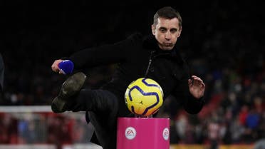 Gary Neville kicks the match ball off a plinth before a match. (Action Images via Reuters)