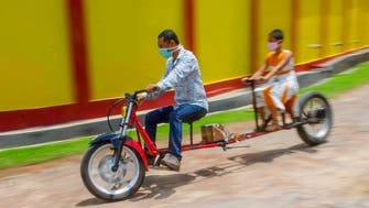 Coronavirus: Indian mechanic invents ‘social distancing’ motorbike