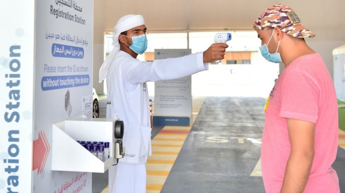 A man tests people for coronavirus in the UAE, April 30, 2020. (WAM)