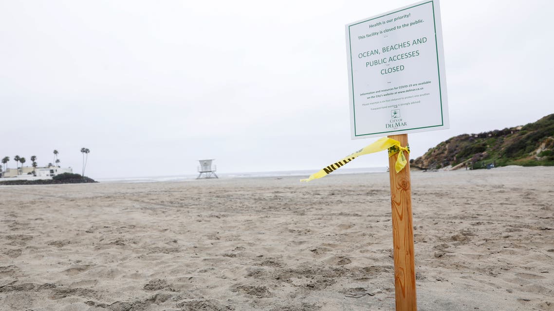 A warning sign is shown at a closed beach park during the outbreak of the coronavirus disease (COVID-19) in Del Mar, California, U.S., April 30, 2020. (Reuters)