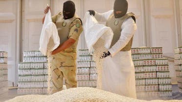 Members of the General Directorate of Narcotics Control display amphetamine pills seized after foiling an attempt to smuggle more than 19 million amphetamine pills into Saudi Arabia. (SPA)