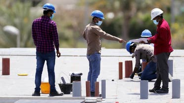 Workers wearing protective face masks work on a residential construction site, following the outbreak of coronavirus disease (COVID-19), in Dubai, United Arab Emirates, April 14, 2020. (Reuters)