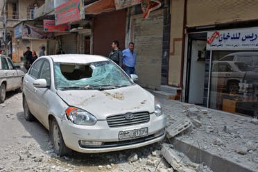 Damages on a street after explosions rocked Syria's central city of Homs on May 1, 2020. (AFP)