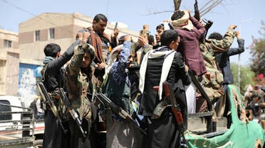 Armed Houthi followers ride on the back of a truck outside a hospital in Sanaa, Yemen April 8, 2020. Picture taken April 8, 2020. REUTERS/Khaled Abdullah