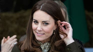 Britain's Catherine, Duchess of Cambridge receives flowers as she visits the Teagasc Animal & Grassland Research Centre at Grange, County Meath, Ireland March 4, 2020. Aaron Chown/Pool via REUTERS
