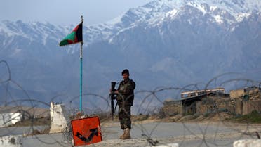 An Afghan National Army soldier stands guard at a checkpoint near the Bagram base north of Kabul, Afghanistan, on Wednesday, April 8, 2020. (AP)