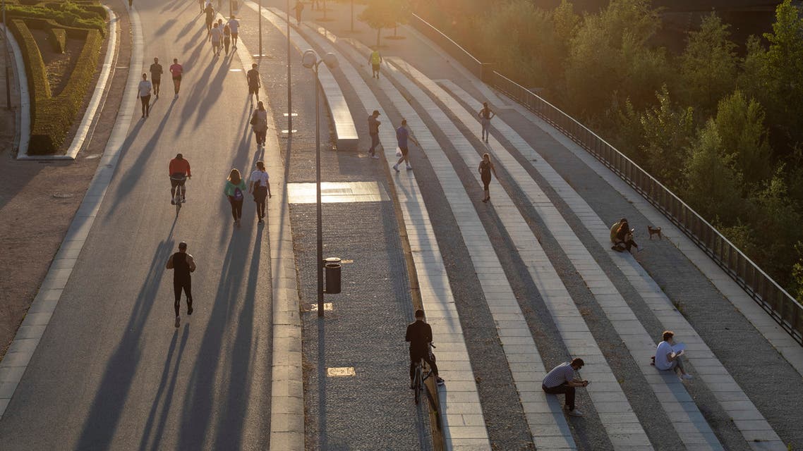 People exercise at Madrid Rio in Madrid, Spain, on Saturday, May 2, 2020. (AP)