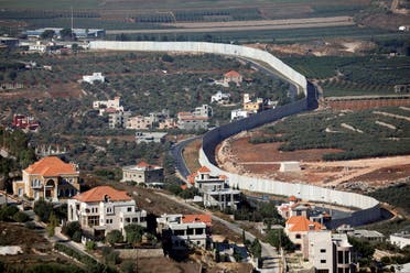 Houses and cars are seen in the Lebanese village of Adaisseh next to the Israel-Lebanon border, as seen from Kibbutz Misgav Am in northern Israel August 26, 2019. (Reuters)