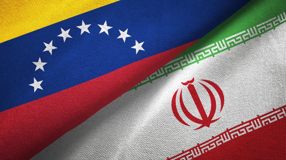 Venezuela and Iran two flags textile cloth, fabric texture stock photo