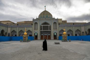 A woman with a mask walks in the yard of a Friday prayer mosque in Shahr-e-Ray, south of Tehran, Iran. (File Photo: AP)