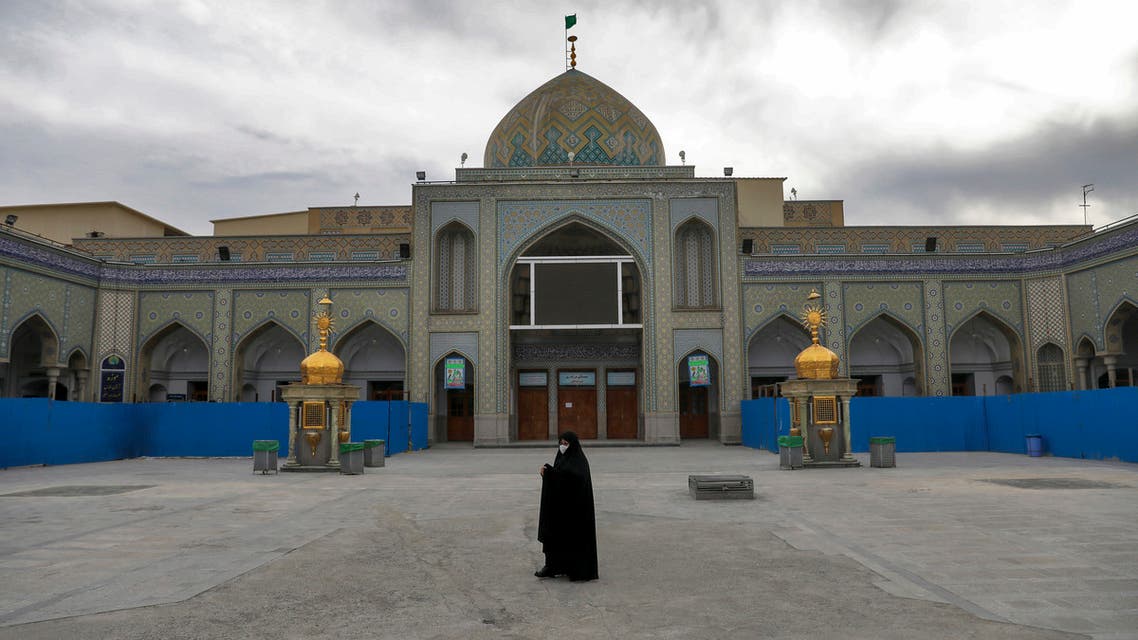 A woman with a mask walks in the yard of a Friday prayer mosque in Shahr-e-Ray, south of Tehran, Iran. (File Photo: AP) 