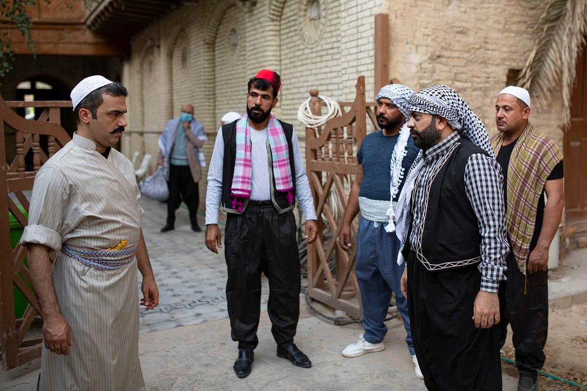 Iraqi actors act out a scene of a parody sketch video adaptation of Bab al-Hara, a long-running iconic Syrian television drama, to raise awareness through videos on the COVID-19 coronavirus pandemic in Iraq's southern port city of Basra on April 22, 2020. (AFP)