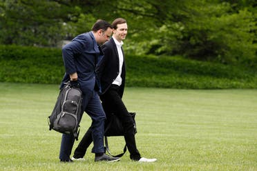 White House Social Media Director Dan Scavino, left, and President Donald Trump's White House Senior Adviser Jared Kushner walk on the South Lawn of the White House after stepping off Marine One with President Trump, Sunday, May 3, 2020, in Washington.  (AP)