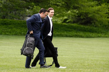 White House Social Media Director Dan Scavino, left, and President Donald Trump's White House Senior Adviser Jared Kushner walk on the South Lawn of the White House after stepping off Marine One with President Trump, Sunday, May 3, 2020, in Washington. (AP)