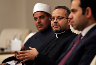 Monsignor Yoannis Lahzi Gaid, personal secretary of Pope Francis, second right, speaks to journalists as Prof. Mohamed Hussein El-Mahrassawy, President of Al-Azhar University, left, and Judge Mohamed Mahmoud Abdel Salam, former advisor to the Grand Imam of Al-Azhar, attend a roundtable discussion in Abu Dhabi, United Arab Emirates on Feb. 3, 2020. (AP)