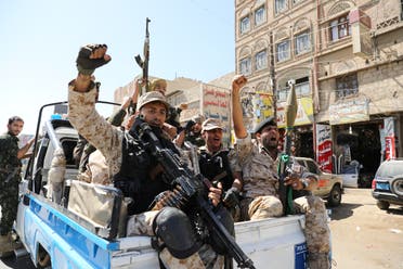 Houthi troops ride on the back of a police patrol truck after participating in a Houthi gathering in Sanaa, Yemen on February 19, 2020. (Reuters) 