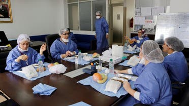 Doctor Meryem Bouchbika and medical stuff eat lunch in the office at Prince Moulay Abdellah hospital as the spread of the coronavirus disease (COVID-19) continues in Sale, Morocco April 23, 2020. (Reuters) 