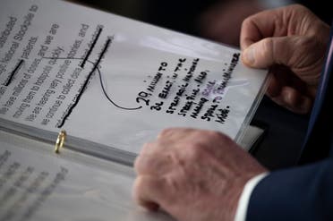 Notes are seen as President Trump speaks during the daily briefing on the novel coronavirus at the White House on April 4, 2020, in Washington, DC. (AFP)
