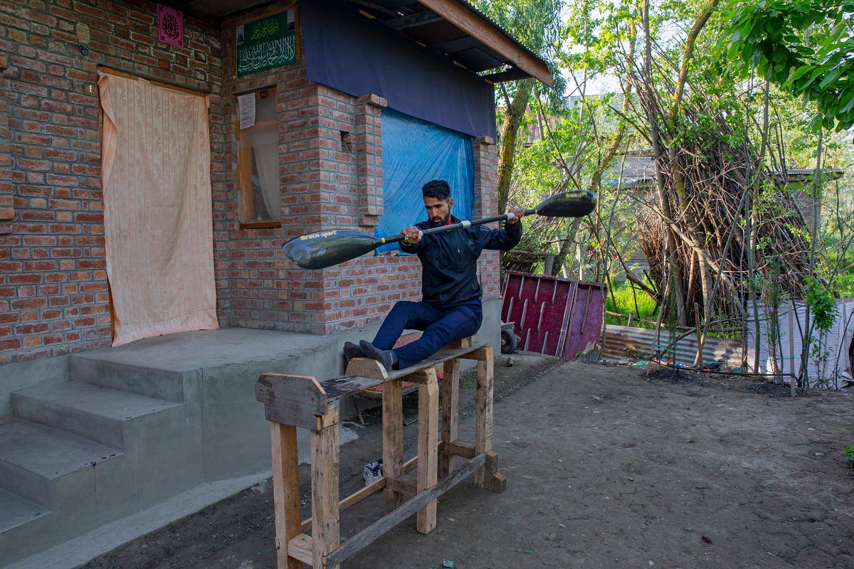 Kashmiri kayaker Vilayat Hussain practises on a rugged under-construction wooden ergometer at his home on the outskirts of Srinagar, Indian controlled Kashmir, on April 24, 2020. (AP)