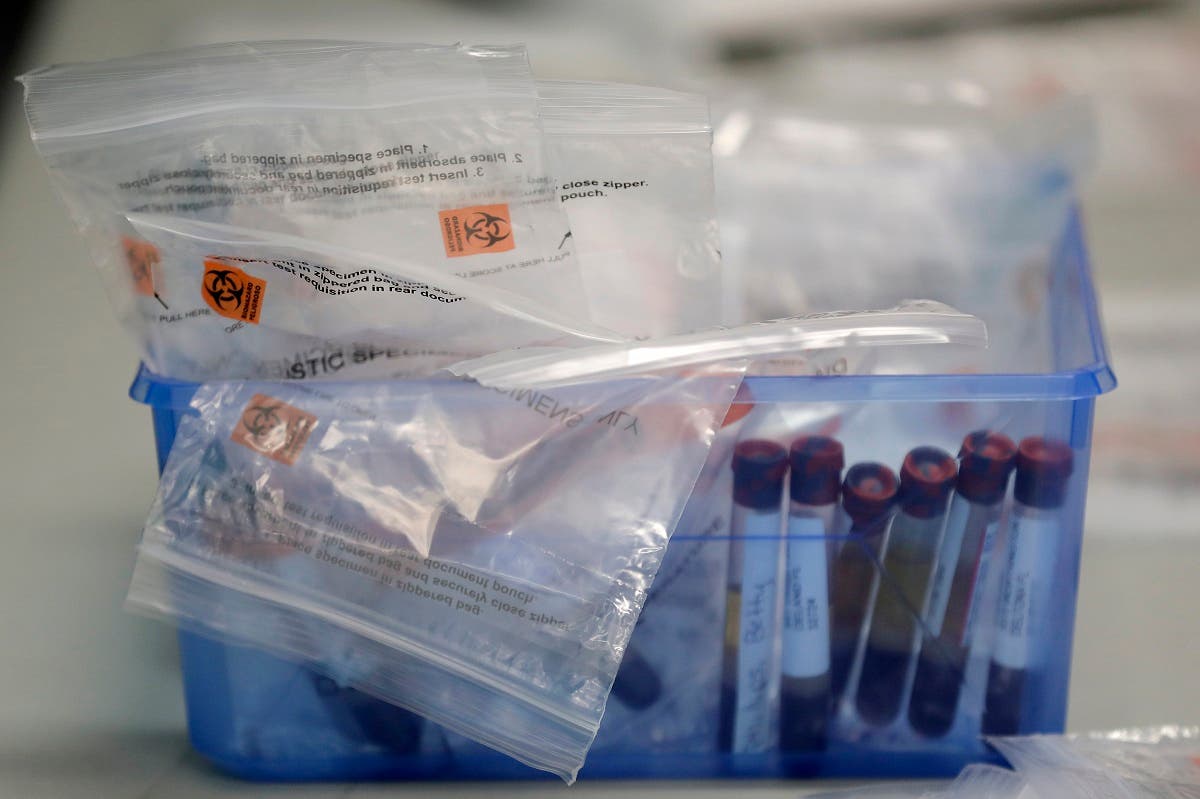 Before being sent to a lab, blood samples from COVID-19 antibody tests are packed in a container. (File photo: AP)