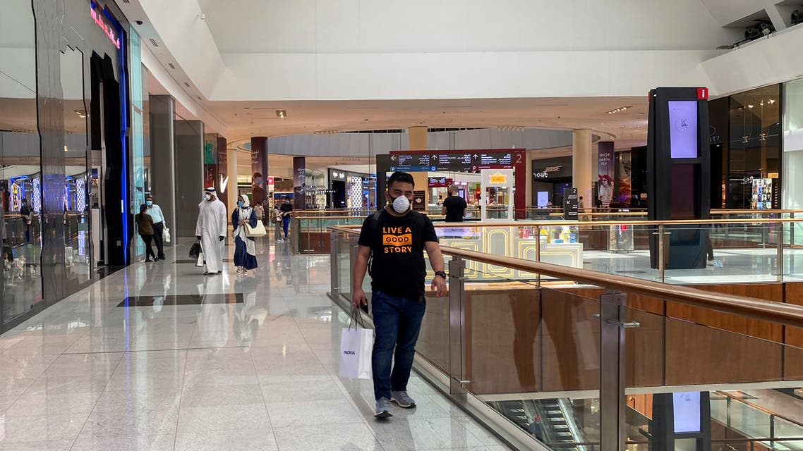 People wearing protective face masks shop at Dubai mall after the UAE government eased a curfew and allowed stores to open, following the outbreak of the coronavirus in Dubai, United Arab Emirates, May 3, 2020. (Reuters) 