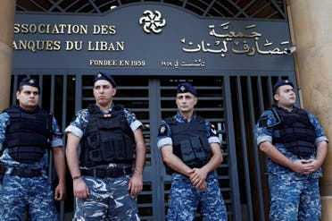 Lebanese police stand outside the entrance of the Association of Banks in downtown Beirut, Lebanon on November 1, 2019. (Reuters) 