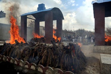 Afghan Sikh men attend a funeral procession and cremation ceremony for those who were killed by a lone ISIS gunman in Kabul, Afghanistan on March 26, 2020. (AP)