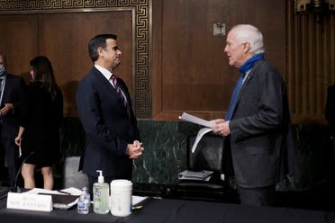 Donald Trump's nominee to lead US intelligence John Ratcliff talks with Senator John Cornyn, at the top of a Senate Intelligence Committee nomination hearing on Capitol Hill in Washington, on May 5, 2020. (AP)