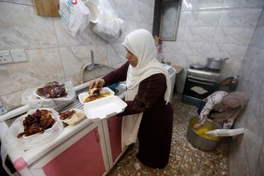 An Iraqi woman Ikhlas Majeed prepares Iftar meals for worshipers and poor families during the holy fasting month of Ramadan in Baghdad's Adhamiya district. (Reuters)