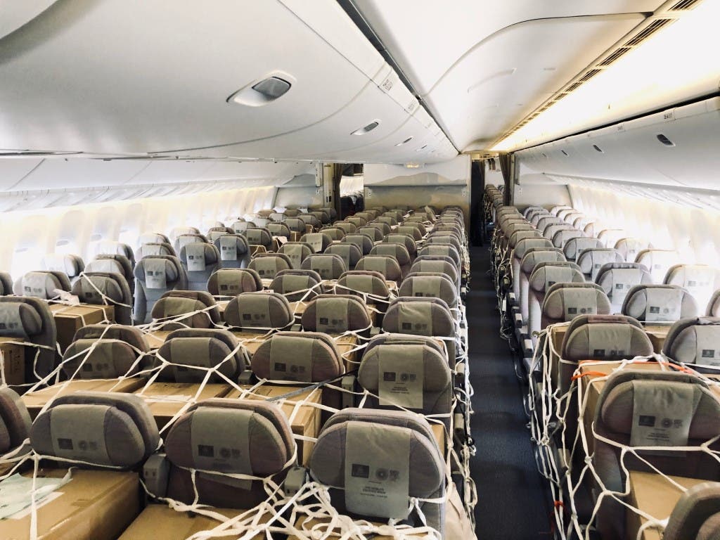 Emirates SkyCargo loads cargo in overhead bins and seats inside the cabin of Boeing 777-300ER passenger aircraft. (WAM)