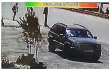 The driver stands feet from the car before it exploded. (Screengrab.)