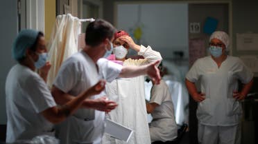 Medics at the Intensive Care Unit (ICU) for coronavirus disease patients at the Robert Ballanger hospital in Aulnay-sous-Bois near Paris, France, April 30, 2020. (Reuters/Gonzalo Fuentes)