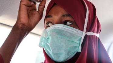 A suspected patient with the COVID-19 Coronavirus is transfered to the public hospital by ambulance in Mogadishu on March 29, 2020. (AFP)