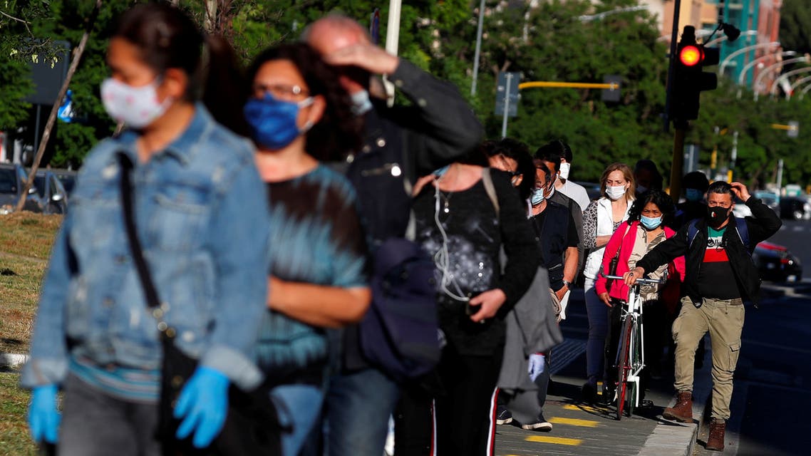 People queue to enter San Giovanni metro station, as Italy begins to ease some of the restrictions of the coronavirus disease (COVID-19) lockdown, in Rome, Italy May 7, 2020. REUTERS/Guglielmo Mangiapane